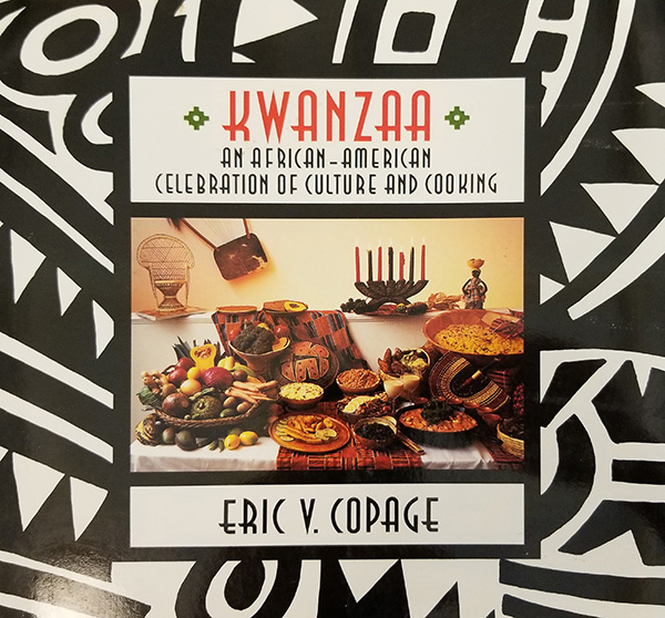 The cover of the book Kwanzaa: An African-American Celebration of Culture and Cooking (New York: Morrow, 1991; 1st edition).