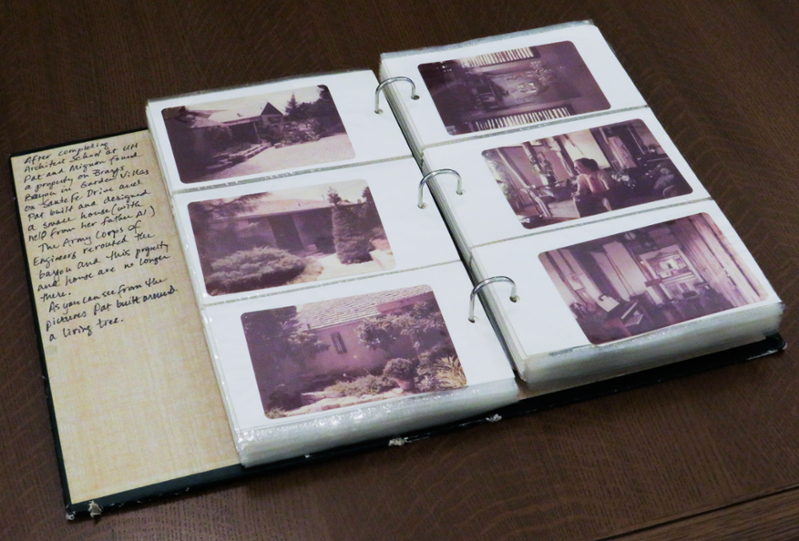 Image of a photo album, representing the lives of life partners Pat Gustavson and Mignon Weisinger. There is a written note on the inside cover, and two pages of the album are displayed. Photos represent one of their homes, as well as Pat.